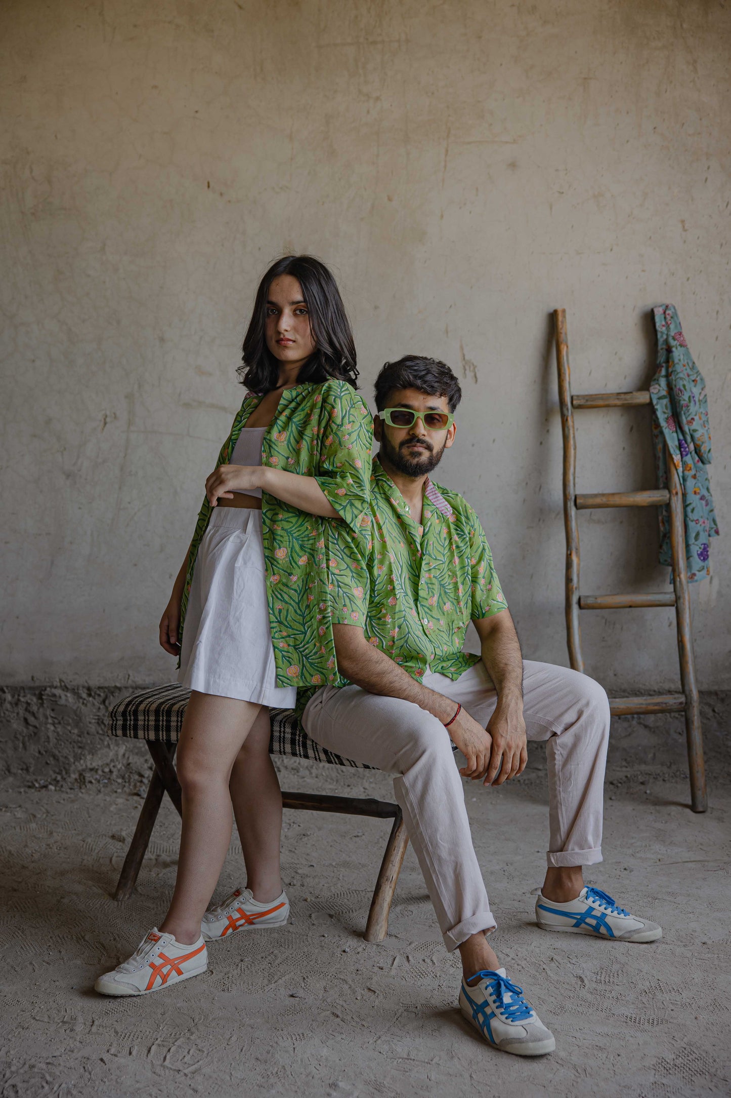 Nonchalant style being portrayed by your twining couple in green floral Poppy summer shirt